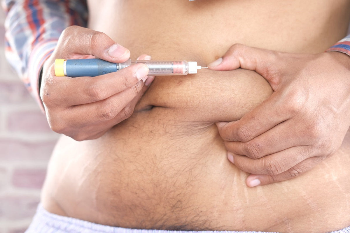 Man with ozempic injection needle