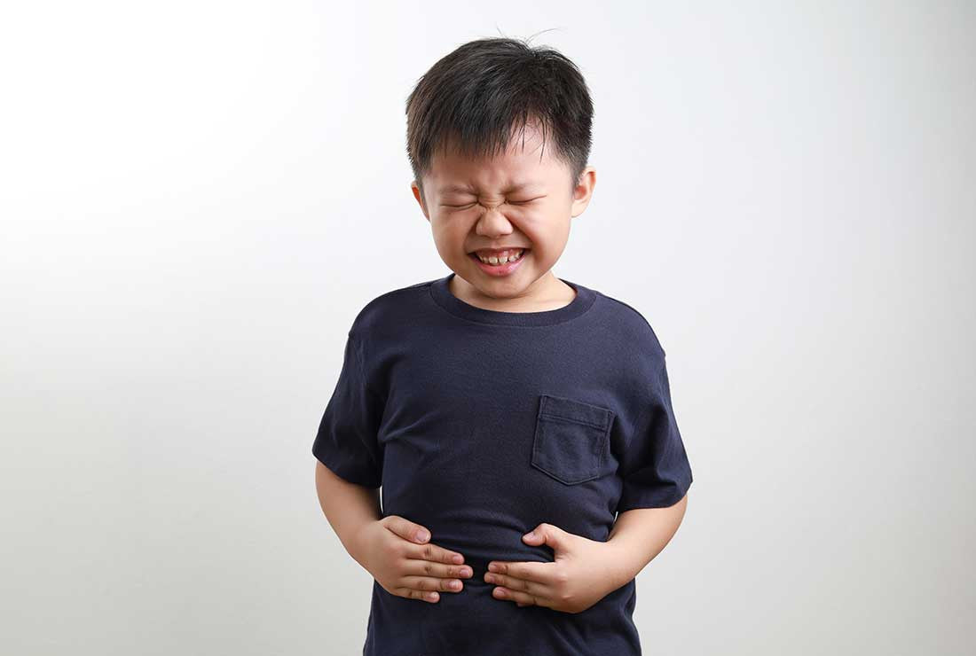 A child showing pain due to acid reflux.