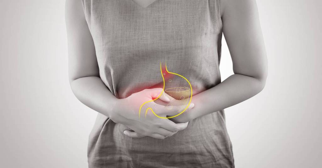 Teen experiencing heartburn