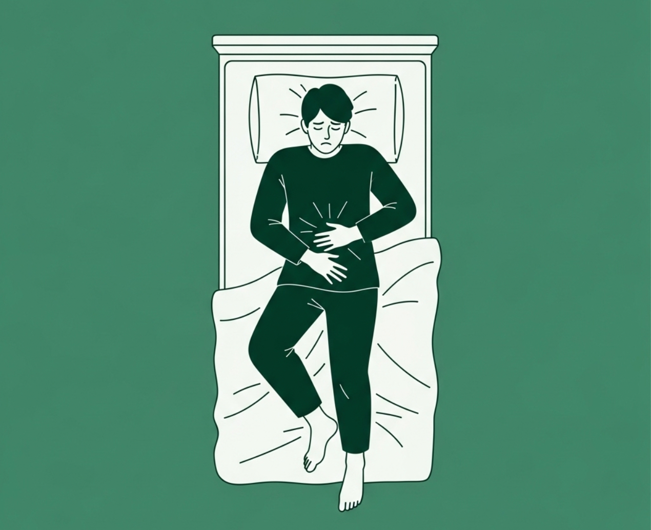 Man clenching his stomach from being bloated at night